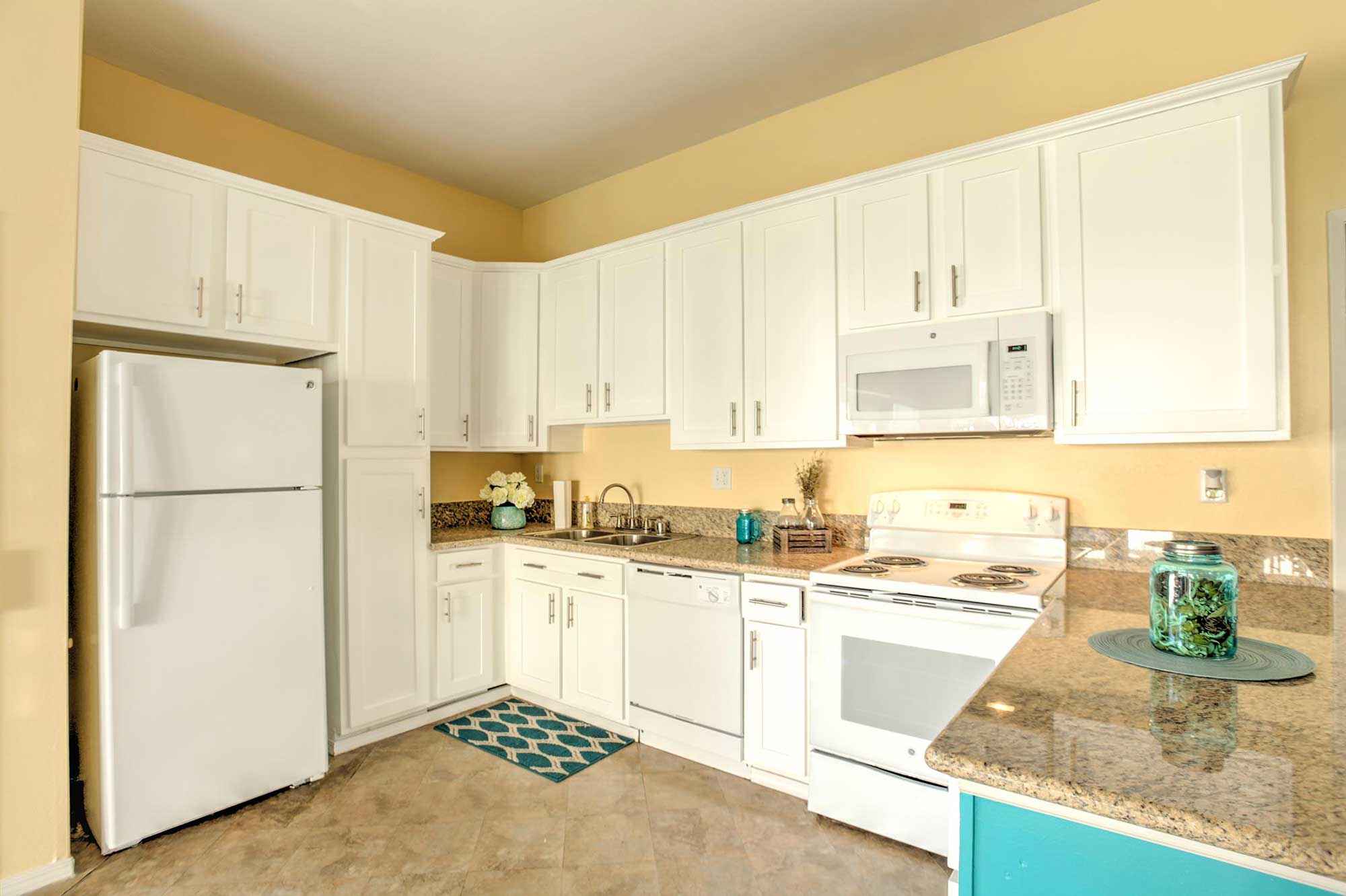 kitchen with white appliance package layout1 at Shadow Mountain