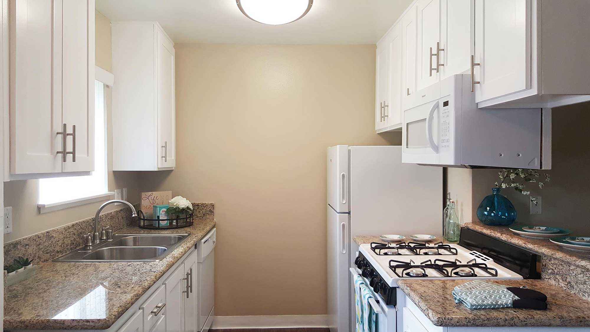 kitchen with white appliance layout2 at Shadow Mountain