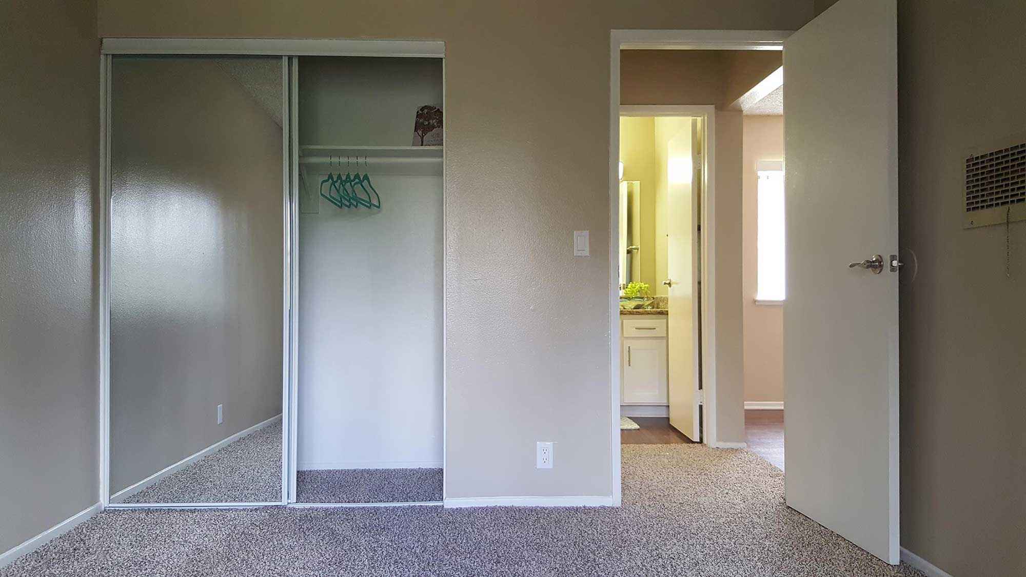 mirrored sliding closet door bedroom at Shadow Mountain
