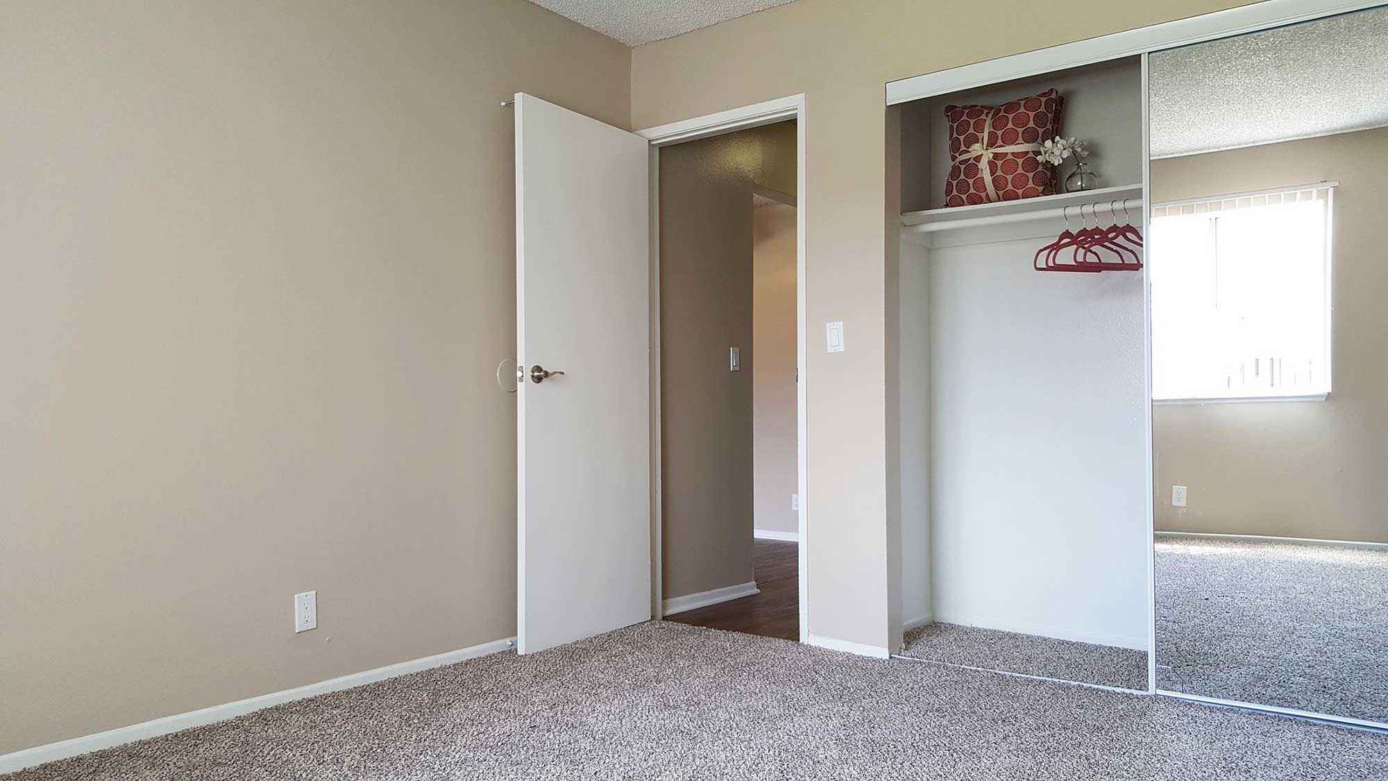 bedroom with mirrored sliding glass closet door at Shadow Mountain