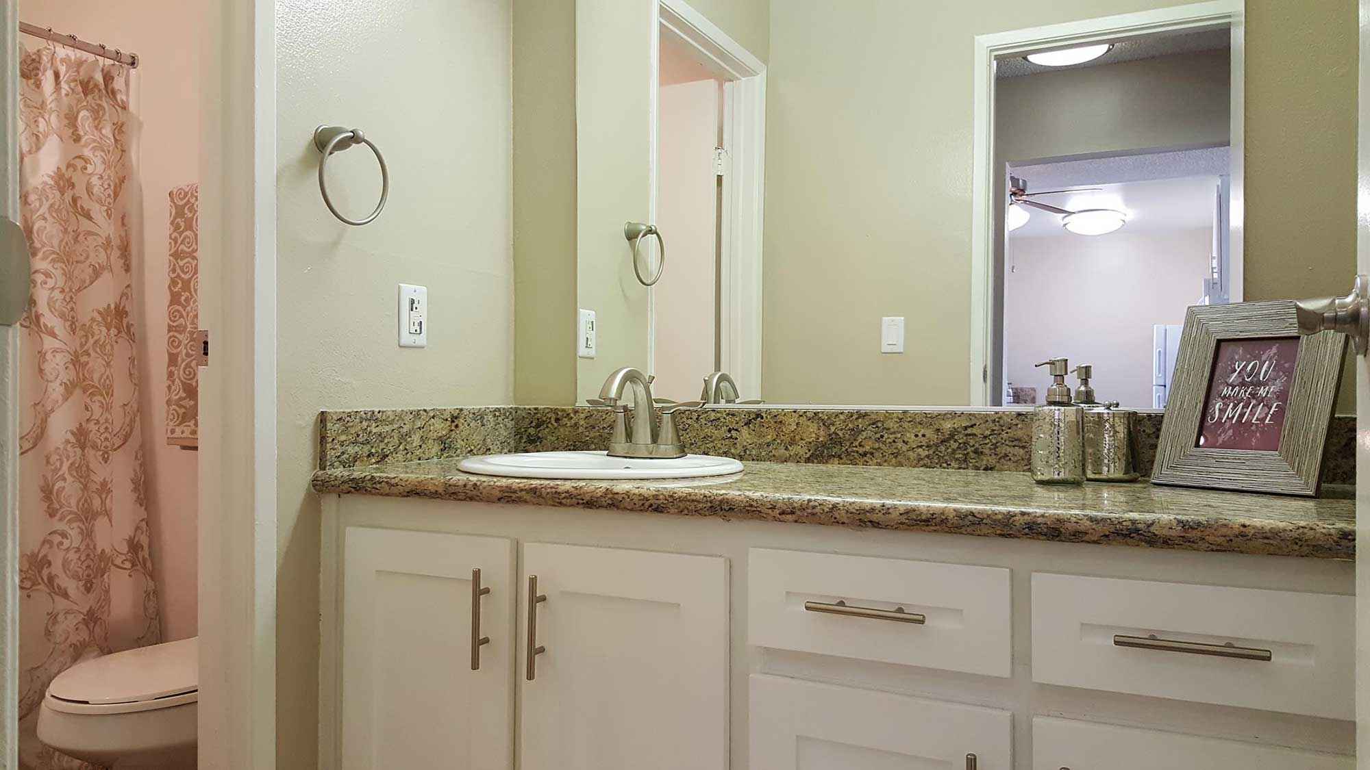 spacious bathroom sink counter mirror at Shadow Mountain